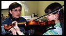 Maria Teaching Violin